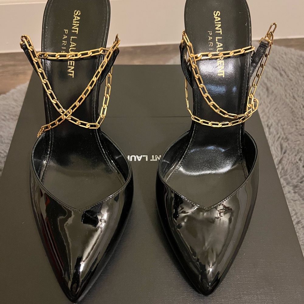 Saint Laurent patent pumps with gold choker.